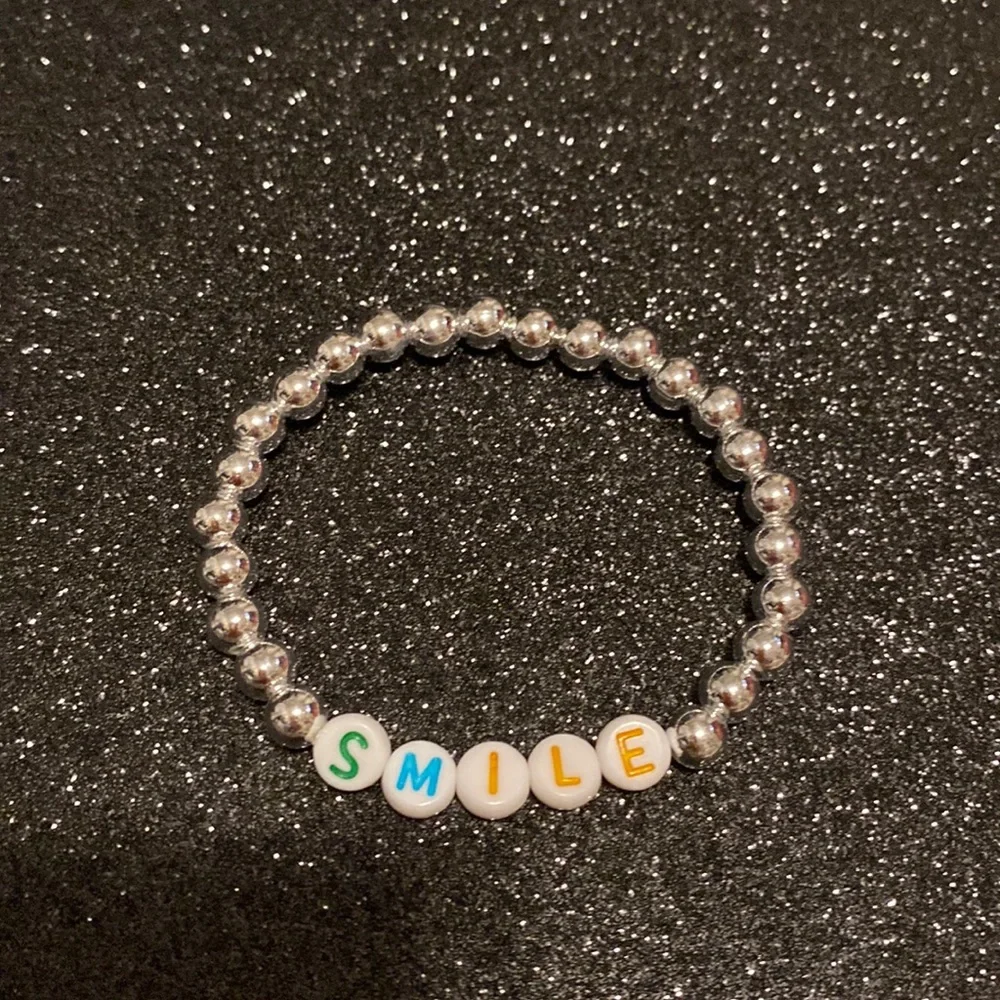 Girls faux silver bead smile stretch bracelet